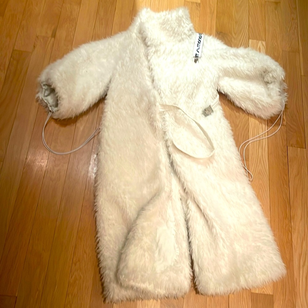 Monosuit polar bear white furry coat.